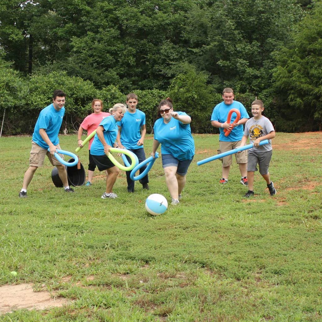 People playing intramural games on softball field